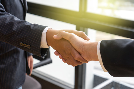 executive businessman hand shake with another business man show their corporationの写真素材