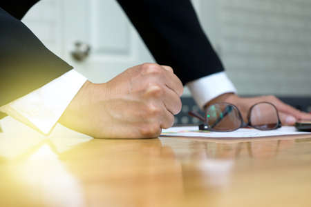 businessman smashed his hand on the table show his power  determineの写真素材