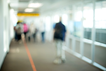 Blur people walking in airport station terminalの写真素材