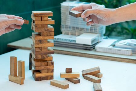 business concept plan and risk project business team work image by Wood block tower with architecture modelの写真素材