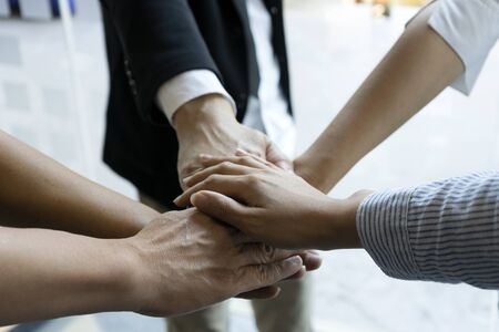 Hand together group office teamwork  show power of success  concept corporate collaboration communityの写真素材