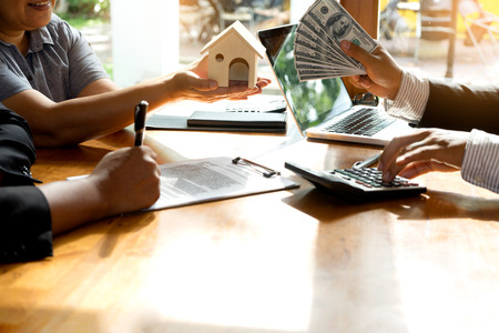 Businessman and customer sign to the contract real estate in buy loan finance and  insuranceの写真素材