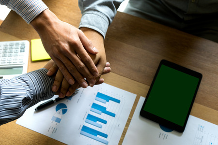 Business team hand together on wood table copy space with tablet screen clipping pathの写真素材