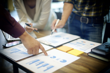Group of business man and woman discussing on the table about startup business in vintage toneの写真素材