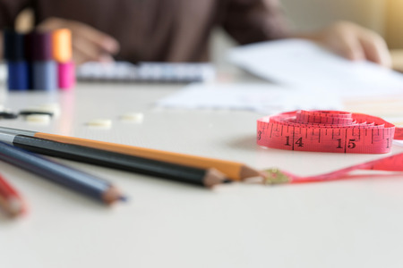 young fashion designer work with fabric cloth on the table or graphic designer の写真素材