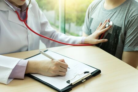 Doctor take care and give consult to the patientの写真素材