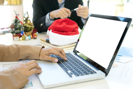 work in office near chrismas time , worker feel to relax for their holiday. Business office decoration for celebrate festivalの写真素材