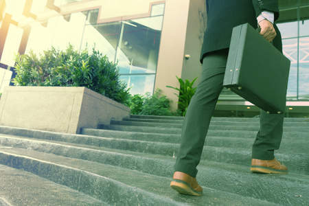 business man chairman stand in front of office building の写真素材