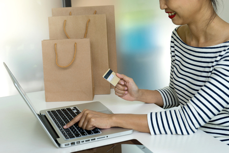 buyer seller use computer for online order for buy the product in the internet use credit card for pay money.の写真素材