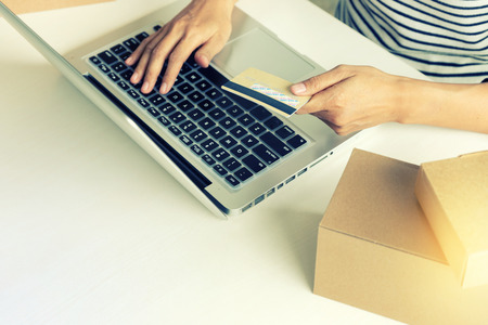 buyer seller use computer for online order for buy the product in the internet use credit card for pay money.の写真素材
