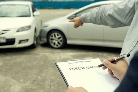 On the road car accident insurance agent examining carcrash  owner and insurance staff make paper...