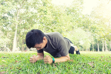 young man push up exercise in the park for his sport outdoorの写真素材