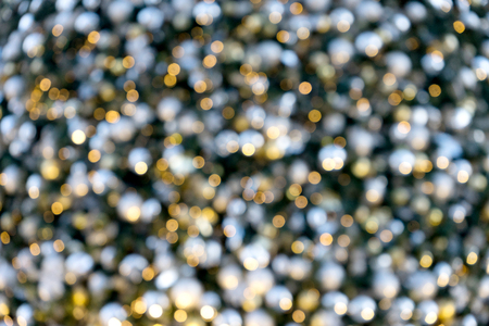 abstract image blur silver gold bokeh xmas tree decorateの写真素材