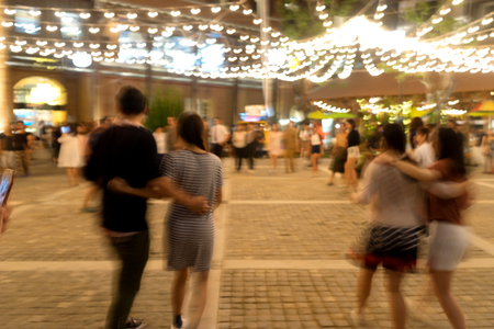 blur image of group dance outdoor under bokeh light in the parkの写真素材