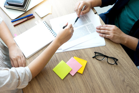 woman and man work for education or business on the table with notebook laptop and paper work color...