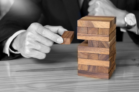 business concept plan and risk project business team work image by Wood block tower with architecture modelの写真素材