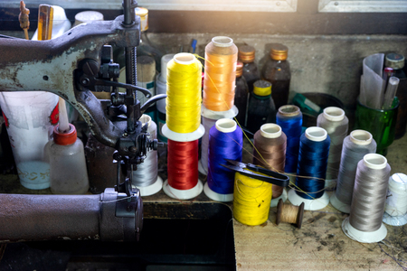 shoe maker work place with sewing leather color threadの写真素材