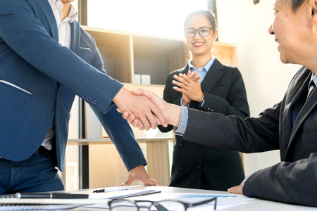 Businessman hand together Handshake for business project teamwork , business people deal successの写真素材