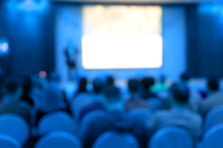Blur of seminar room in convention hall , hotel or big room . blue toneの写真素材