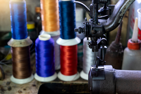 shoe maker work place with sewing leather color threadの写真素材