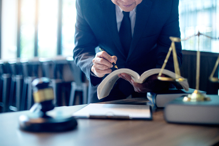 Judge lawyer gavel work in office with  balance  in law firm conceptの写真素材