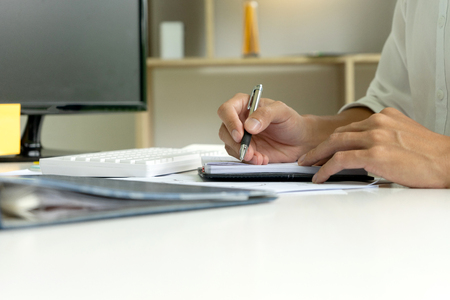woman and man work for education or business on the table with notebook laptop and paper work color penの写真素材