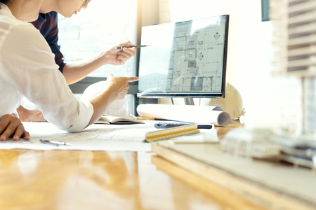 engineer or architectural project, two engineering or architecture discussing and working on blueprint with architect equipment, Construction concept.の写真素材