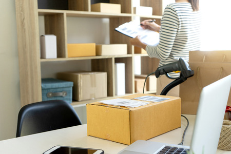 young woman work in back office for checking the product in the warehouse, concept ecommerce