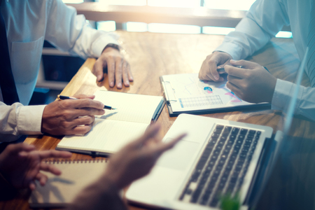 business businessman woman in meeting analyses chart graphy marketing plan in business projectの写真素材