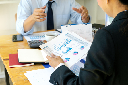business businessman in meeting analyses chart graphy marketing plan in business financial  audit project. Or Business adviser analyzingの写真素材