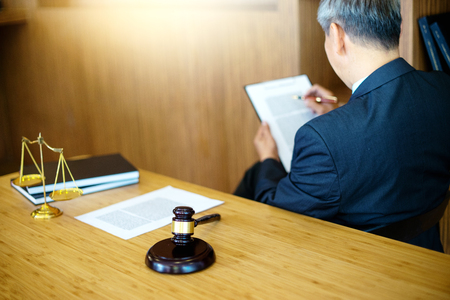 Judge gavel with Justice lawyers, Businessman in suit or lawyer working with legal law documents.  advice and justice law firm concept.の写真素材