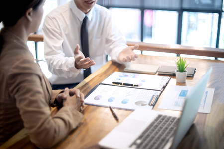 business businessman woman in meeting analyses chart graphy marketing plan in business projectの写真素材