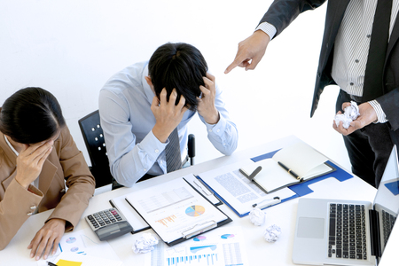 Boss angry and fell bad shouting at his workers staff  who can not done good job. Worker feeling despair avoiding bothering clients.の写真素材