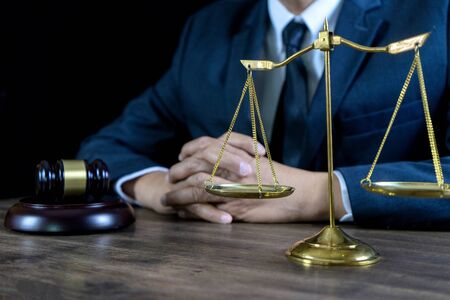 Judge lawyer gavel work in office with  balance  in law firm conceptの写真素材