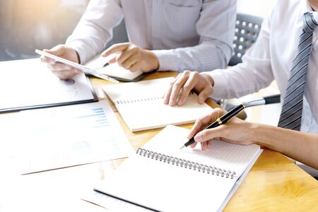 in company businessman in business  meeting analyses chart graphy marketing plan in business projectの写真素材