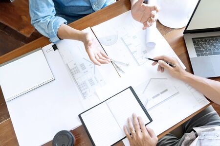 Group of engineering or architect discussing and working on blueprint with architect equipment, Construction engineer or architectural project  concept.の写真素材