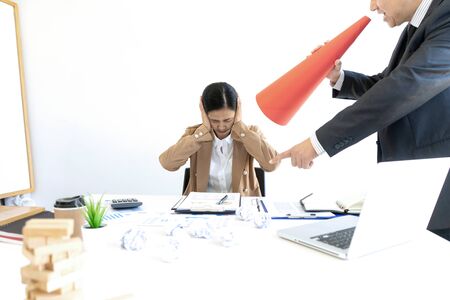 in the office, Boss angry and fell bad shouting at his workers staff. The wood block crash and fall down on the table, concept project mistake.の写真素材