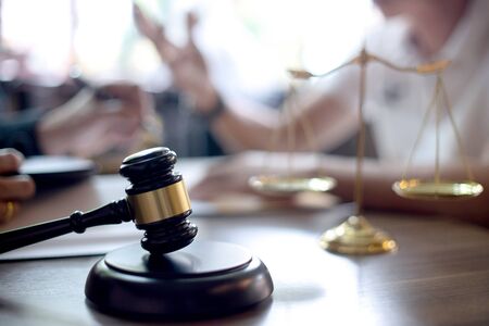 on the table how to  use arbitration ,  Lawyer or judge gavel with balance work with client or...