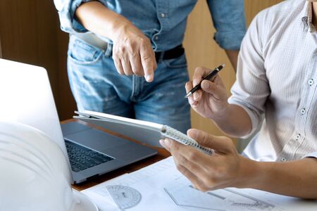 Group of engineering or architect discussing and working on blueprint with architect equipment, Construction engineer or architectural project  concept.の写真素材
