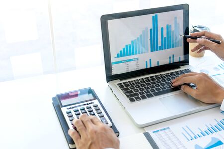 businessman in meeting analysis chart graphy marketing plan in business financial  audit project. Or Business adviser analyzing Budget.の写真素材