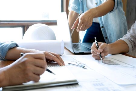 Group of engineering or architect discussing and working on blueprint with architect equipment, Construction engineer or architectural project  concept.の写真素材
