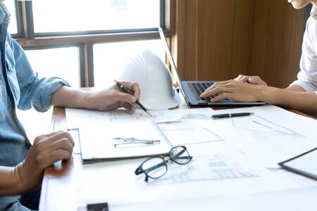 Group of engineering or architect discussing and working on blueprint with architect equipment, Construction engineer or architectural project  concept.の写真素材