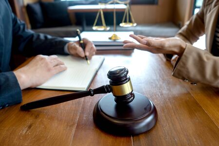 Judge gavel with Justice lawyers, Businessman in suit or lawyer working with legal law documents.  advice and justice law firm concept.の写真素材