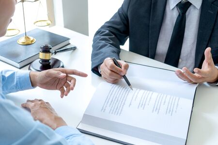Lawyer or judge gavel with balance work with client or customer about agreement how to  use arbitrationの写真素材