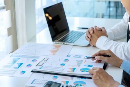 businessman in meeting analysis chart graph marketing plan in business financial  audit project. Or Business adviser analyzing Budget.の写真素材