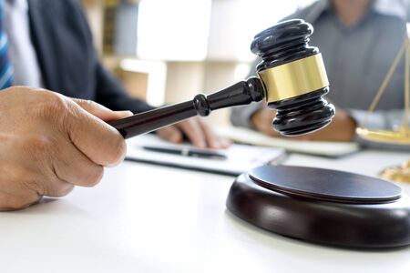 Judge or lawyer talking  with team or client about consult law detail and prepare to sign contract agreement, law firm conceptの写真素材