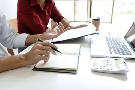 Group of Businessman work about analysis marketing data in the office workplace. with computer laptop and desktop and monitor.の写真素材