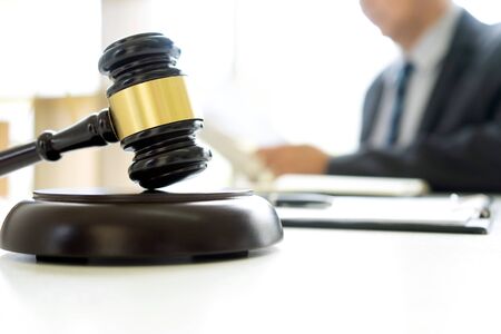 In the office of Judge or lawyer, there are balance and gavel on the table. Law firm Concept.の写真素材