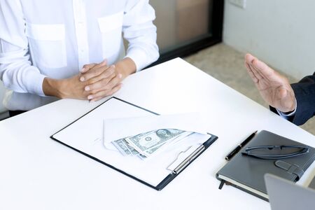 Business man give bribe to the officer but officer say no concept corruptionの写真素材
