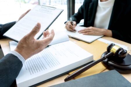 Lawyer or judge gavel with balance work with client or customer about agreement how to  use arbitrationの写真素材
